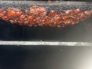 Food cooking inside the smoker